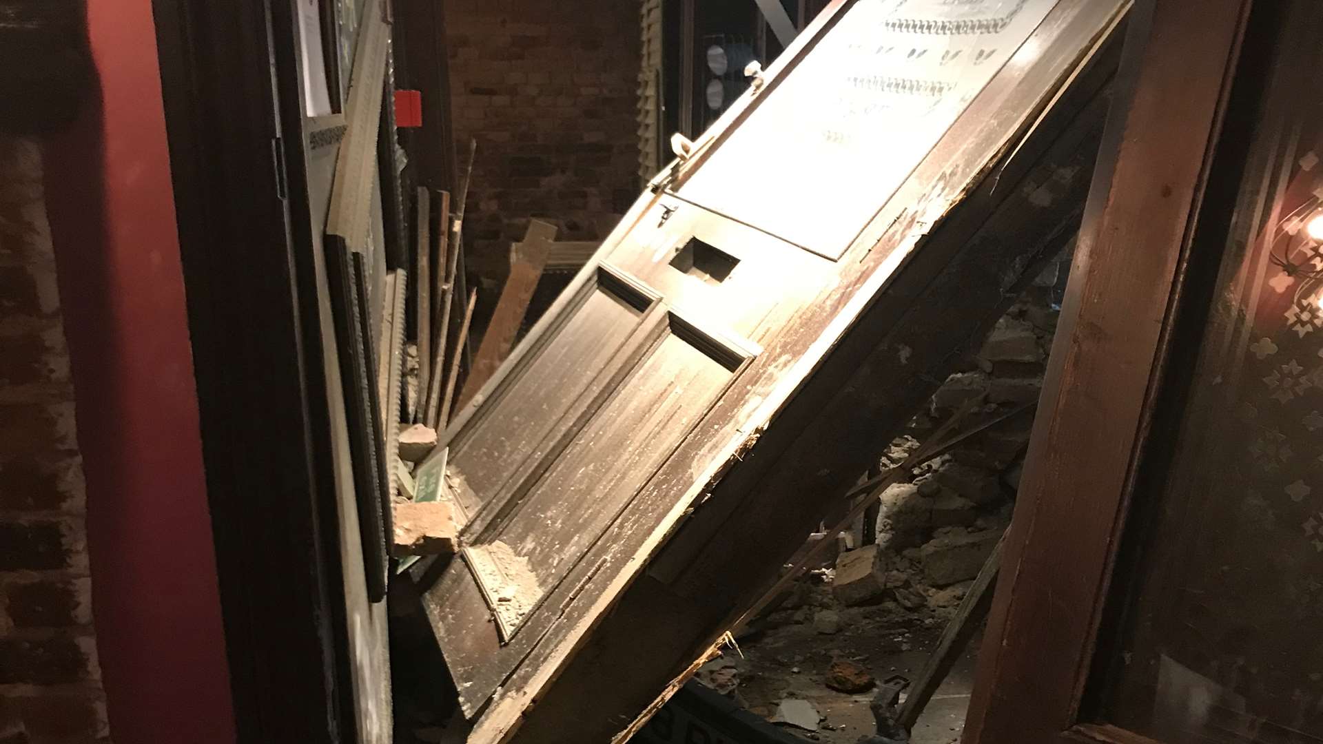 The pub's door which was smashed off its hinges in the impact
