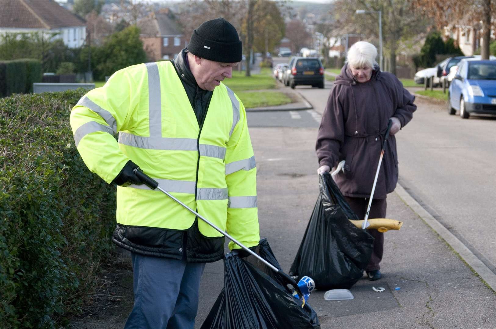 A community warden takes part in a litter pick. File picture