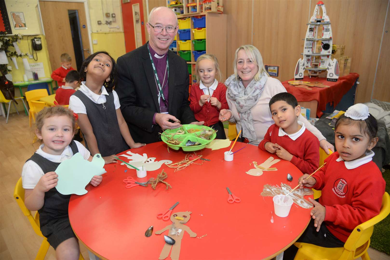 Bishop James Langstaff praised the community roles he had encountered during his time as bishop. Pictured here with teacher Lisa Thomas and Rabbit class pupils at St Johns Infant Primary School last October