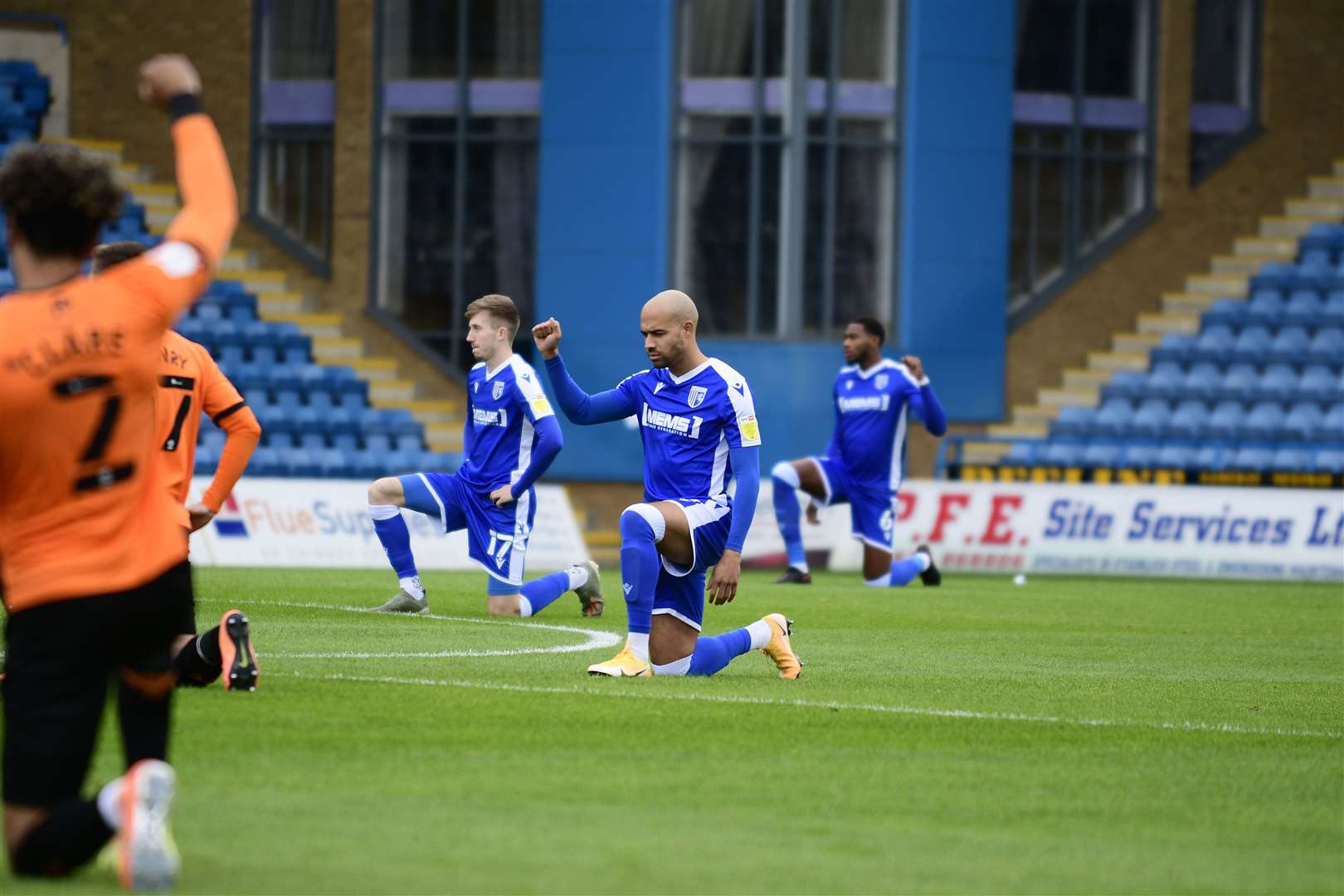 Gillingham players take to their knee in protest and the club will now join a social media blackout Picture: Barry Goodwin