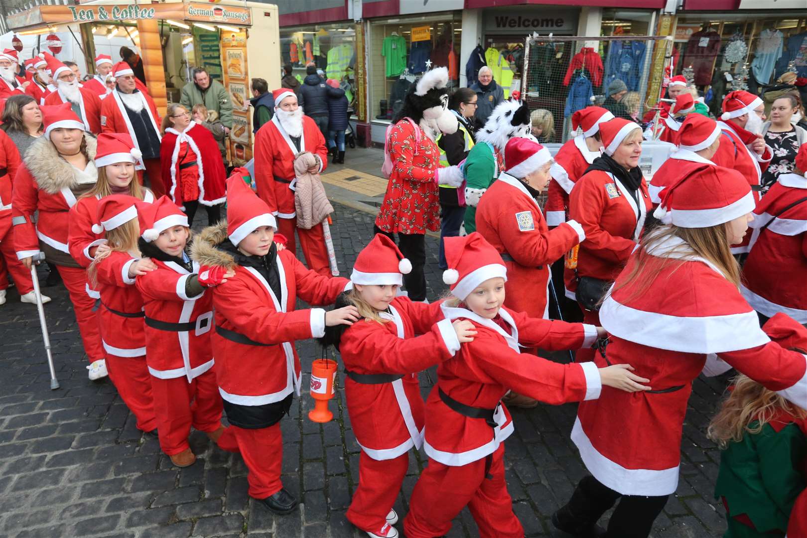 Lots of Santas Saunter in a conga at the Sheerness Clock Tower, getting ready for the Christmas Lights switch on last year Picture: John Westhrop FM5011600 (5003238)