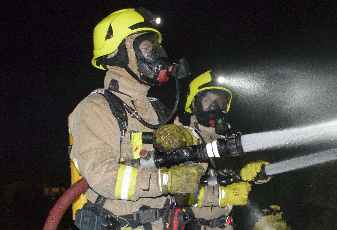 Crews wearing breathing apparatus tackled the flames. Stock picture