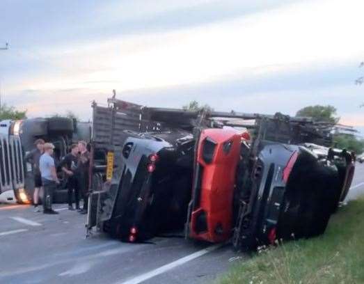 Hundreds and thousands of pounds worth of cars were damaged after a car transporter overturned. Picture: Ben Slipper