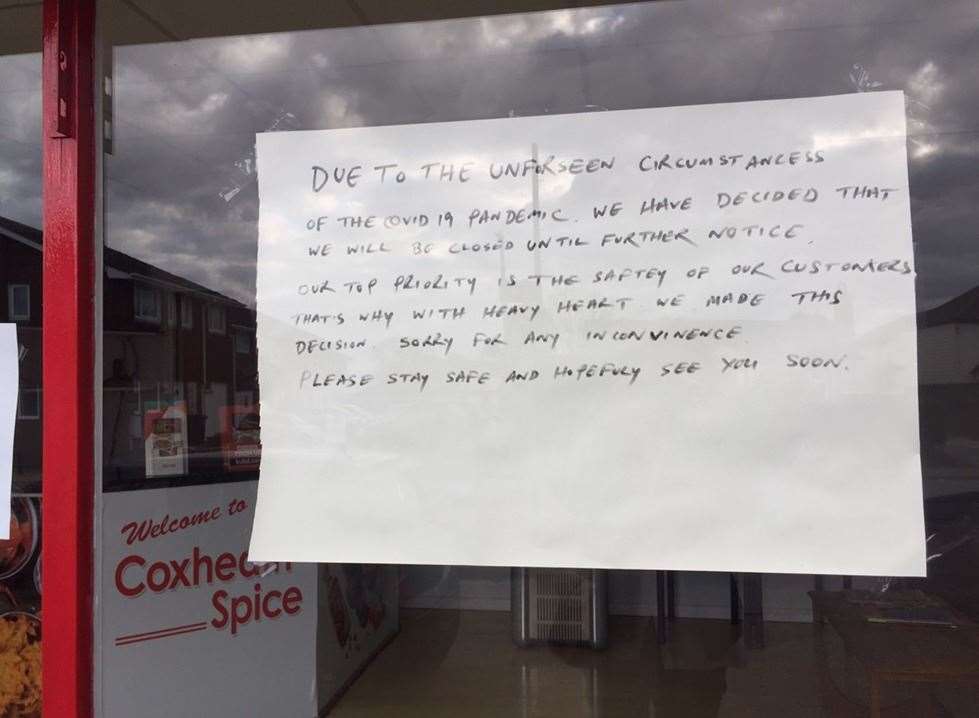 A sign posted in the window of Coxheath Spice Takeaway