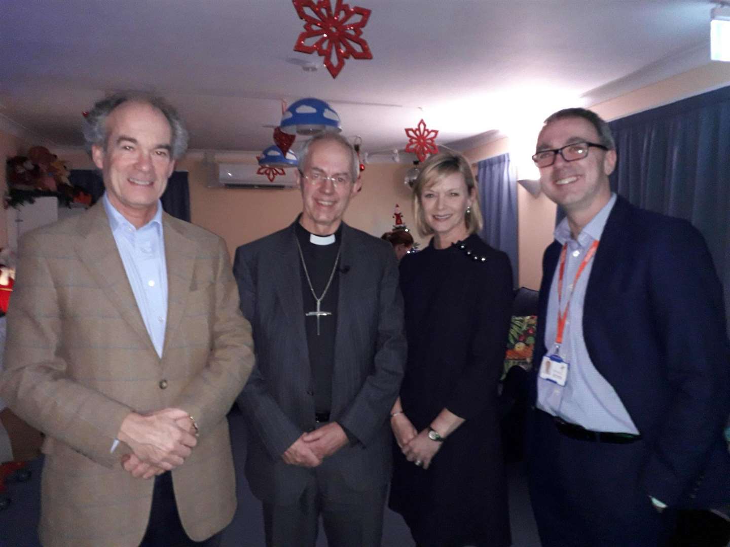 The Archbishop of Canterbury Justin Welby, with Demelza's president Richard Oldfield and chief executive Ryan Campbell