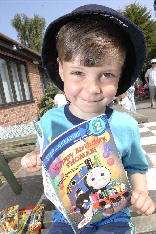 Isaac Vickery, four, with his book purchased at the Elliott Park School summer fair