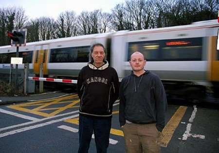 Chris Hoare, right, and Roger Chandler, who pushed the stricken car and driver off the level crossing moments before a train went through.