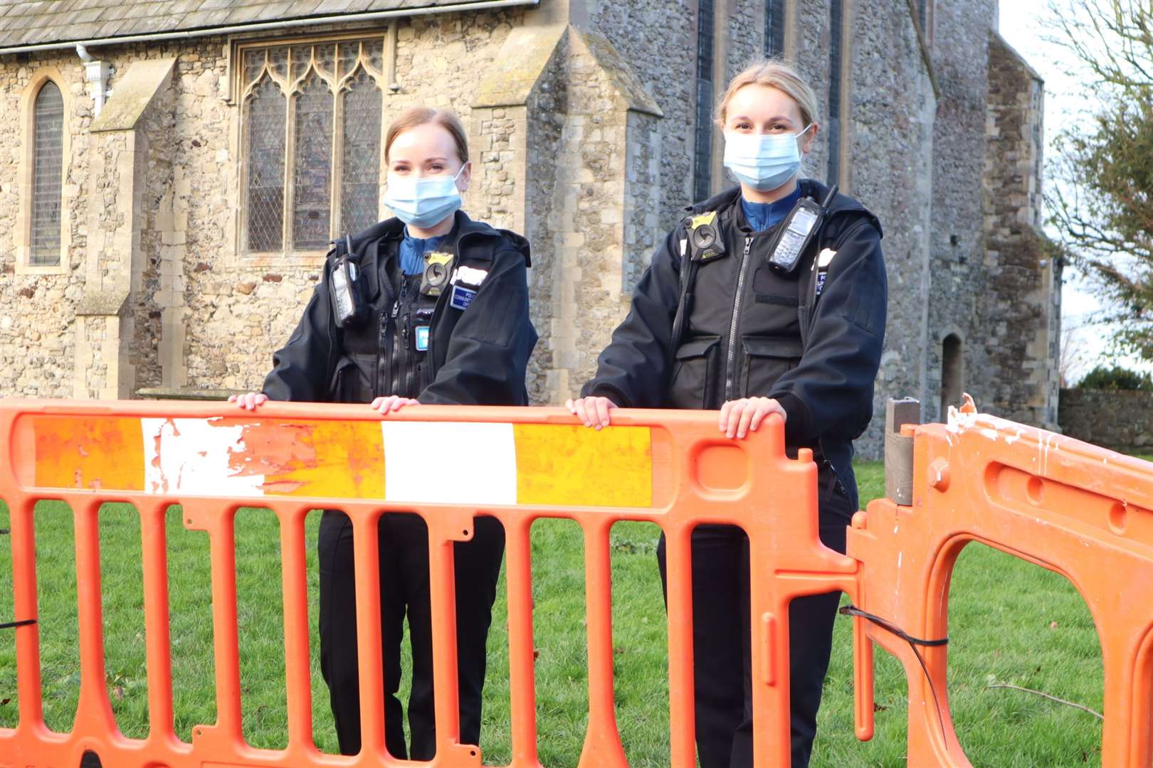 Police community support officers Ashden Judd, left, and Sarah Jones are looking into the gaping hole which has appeared in the graveyard of Minster Abbey on Sheppey. Could it be a long lost tunnel or an old tomb?