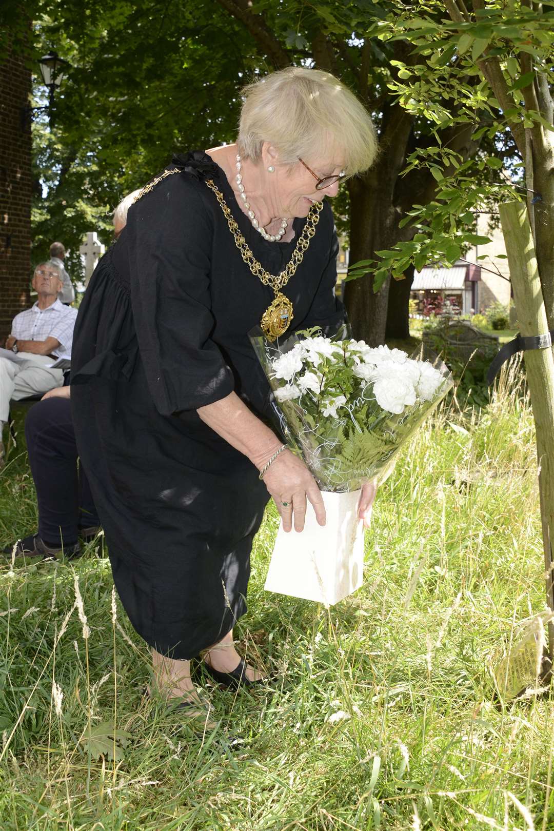 Mayor of Deal Cllr Eileen Rowbotham lays flowers at the Hiroshima Tree