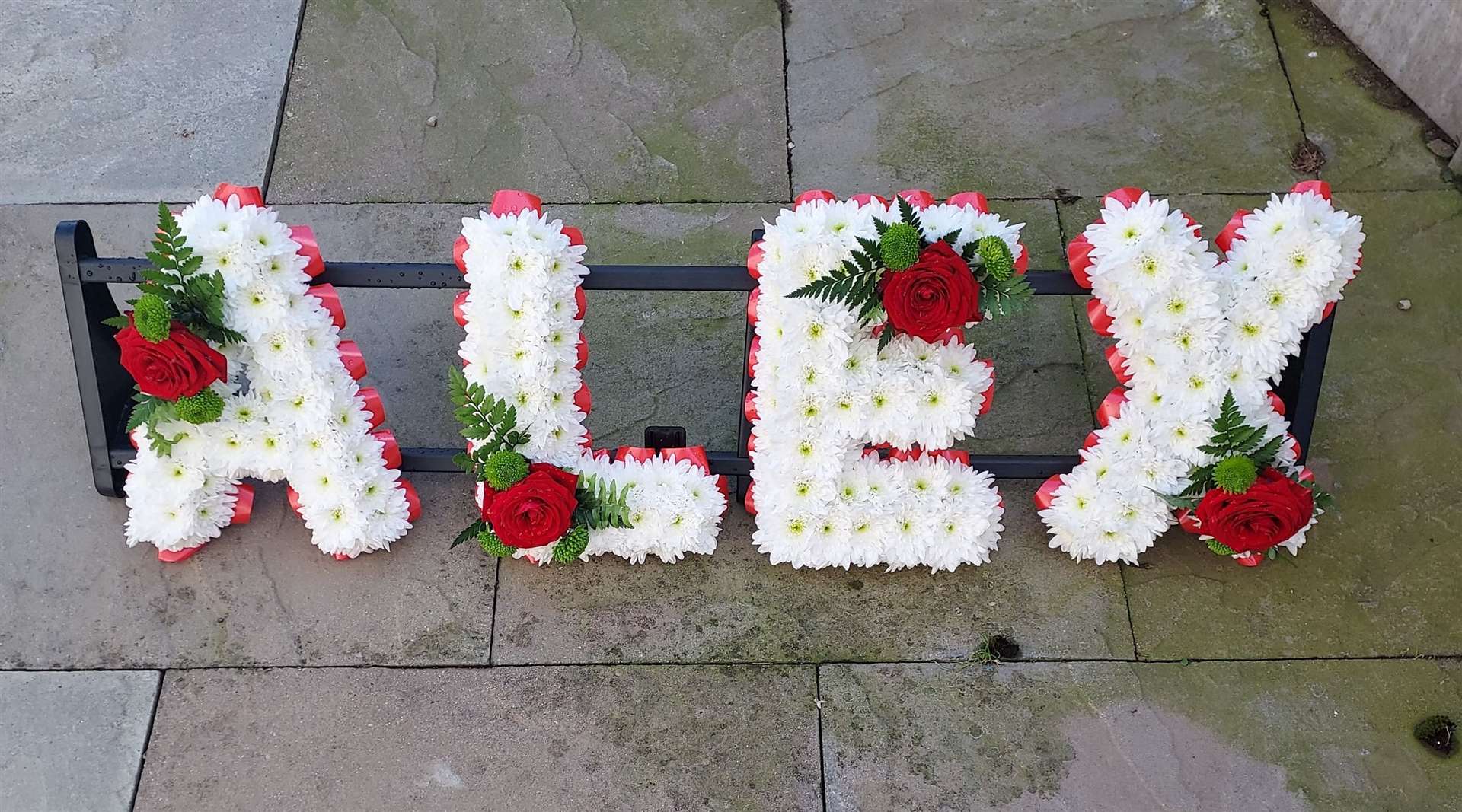 Alex's name was spelt out in flowers