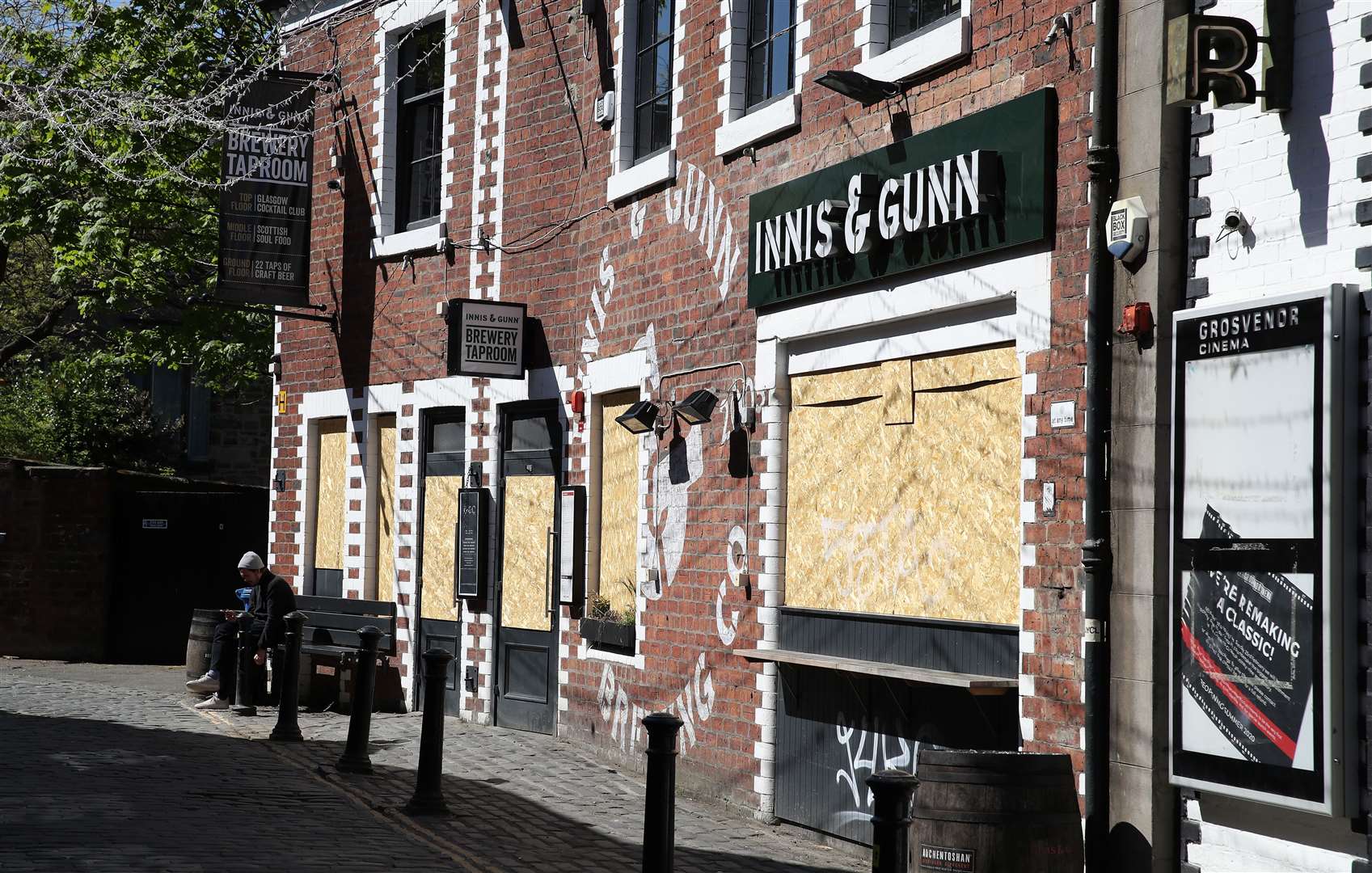 Boarded-up restaurants and pubs in Ashton Lane, Glasgow (Andrew Milligan/PA)
