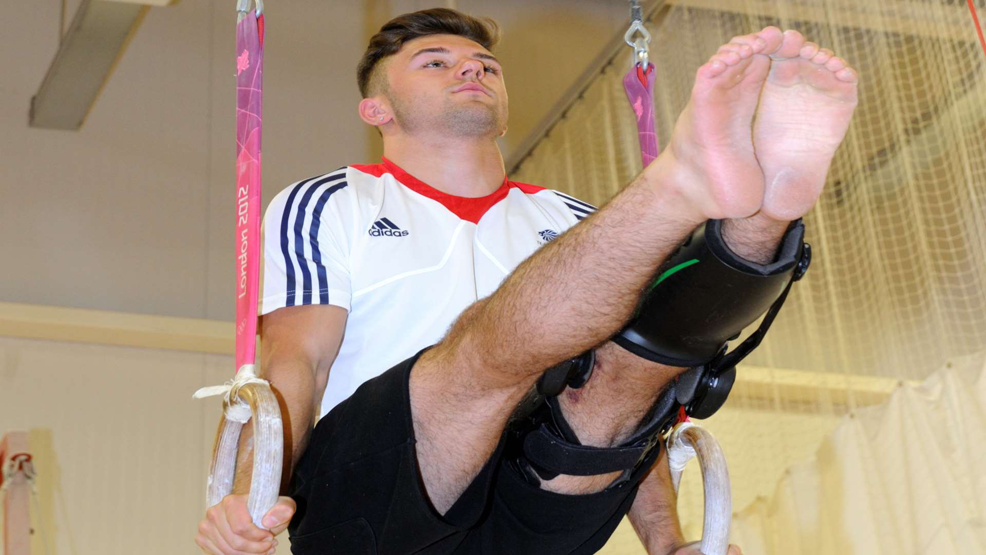 The leg brace may stop him competing, but it won't put a stop to his training regime.