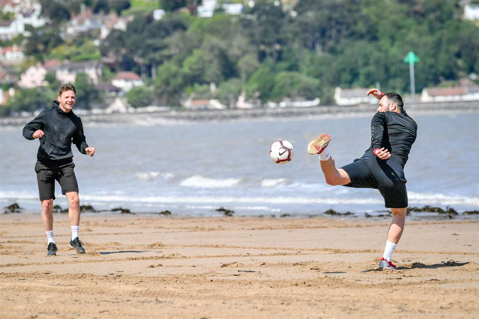Socially distanced exercise was also in evidence on the beach (Ben Birchall/PA)