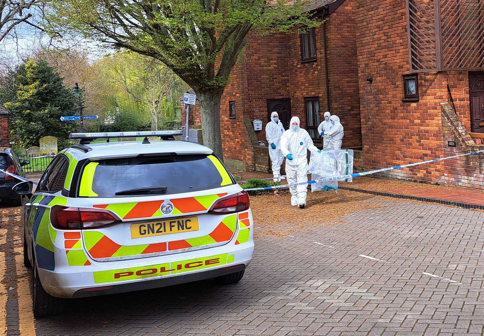 Police and forensics investigate a suspected murder after a man was found dead in Castle Street car park in Canterbury