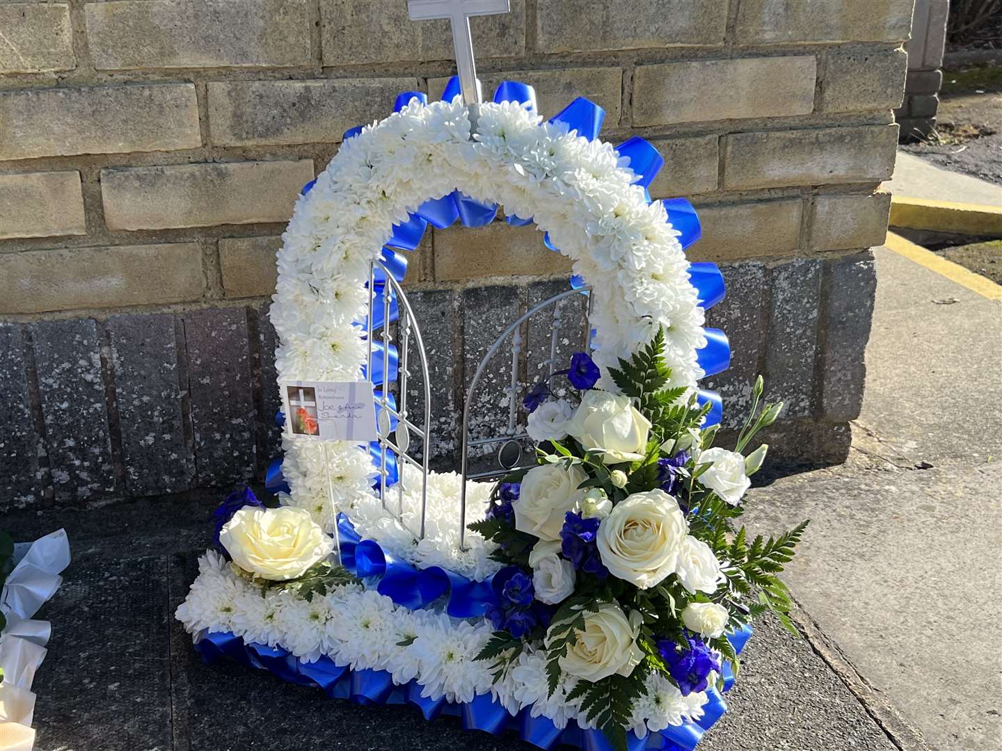 Flowers left as mourners remember father and son Johnny Cash and Johnboy Cash. Picture: Barry Goodwin