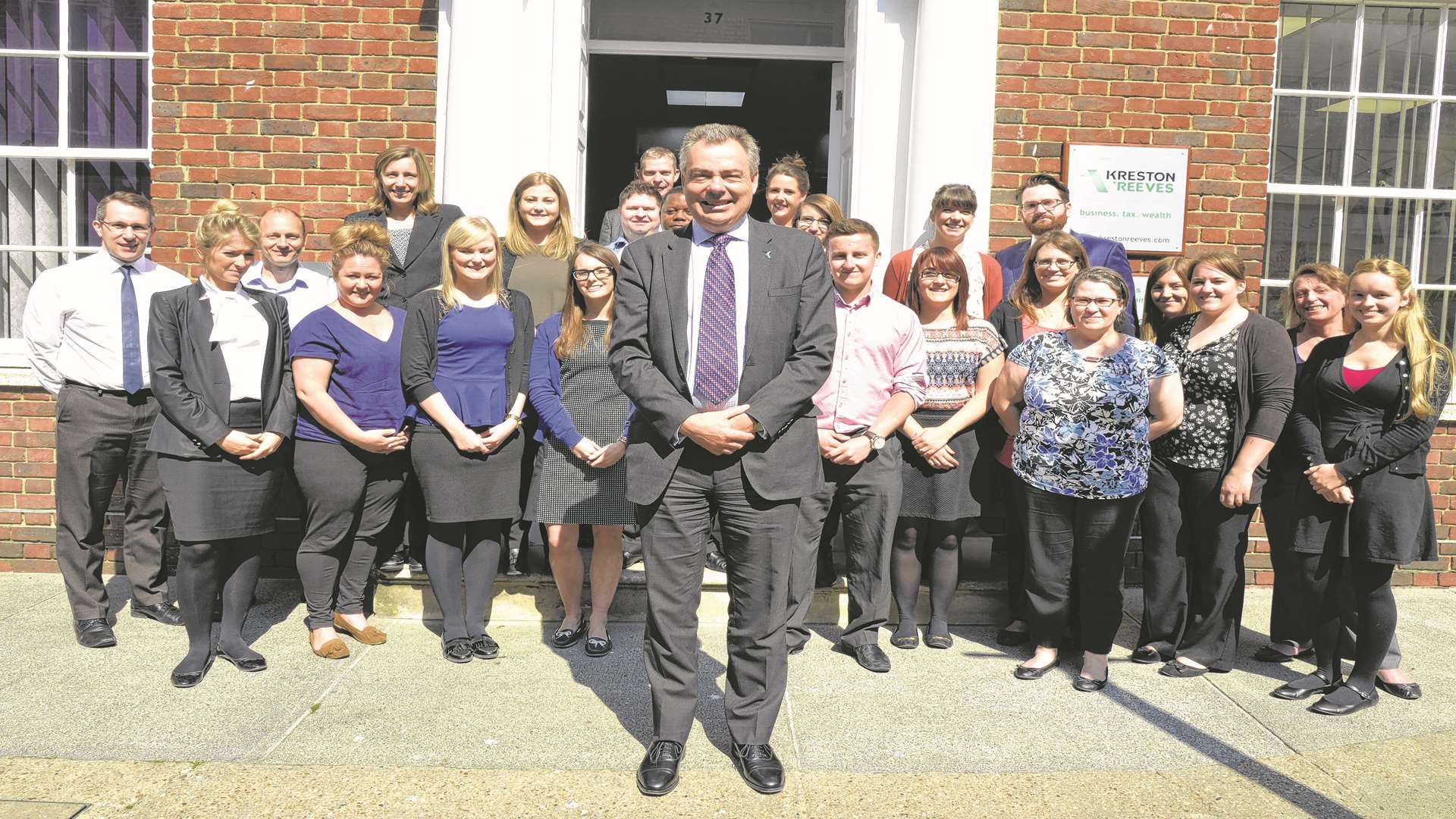Kreston Reeves senior partner Andrew Griggs with staff outside its Canterbury office