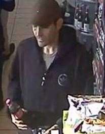 CCTV shows Robertson attempting to buy goods from a service station in Sidcup