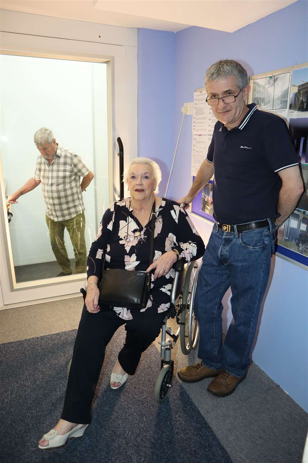 Ann Michalski, former chairman of the Sittingbourne Disabled Club, was able to visit upstairs at the Criterion Theatre, Blue Town, for the first time thanks to its new lift. She is pictured with helper Tim Pyne. Derek Griffiths was in the lift.