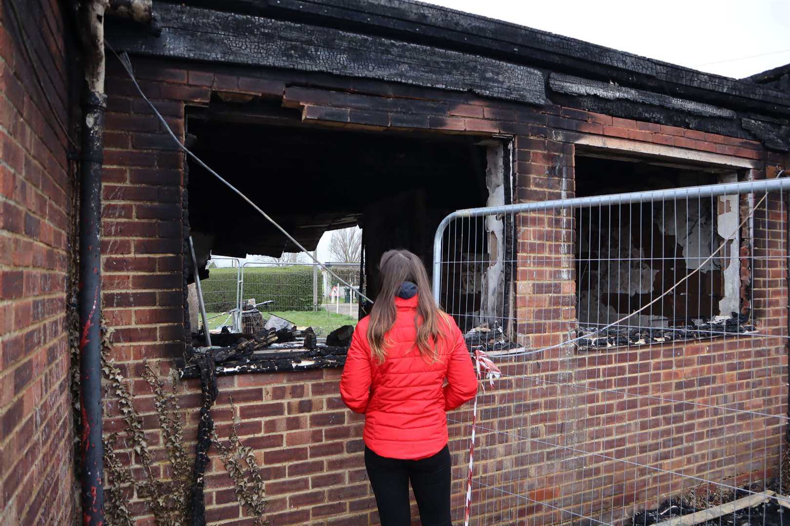 Deni Kerswell, 20, surveys the damage after the chalet fire in Leysdown, Sheppey