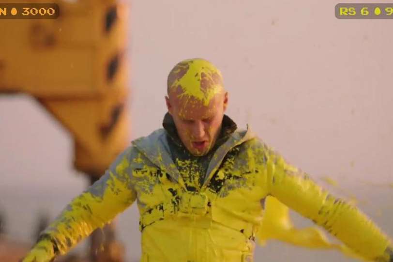 Free-running expert Damien Walters is covered in yellow paint