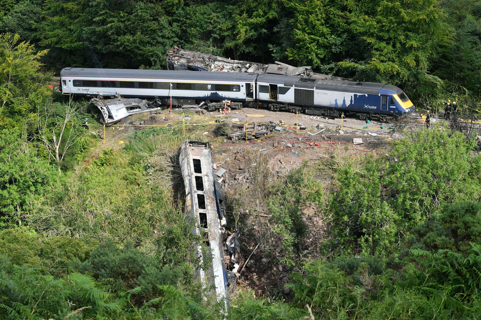 One carriage plunged down an embankment in the incident (Ben Birchall/PA)