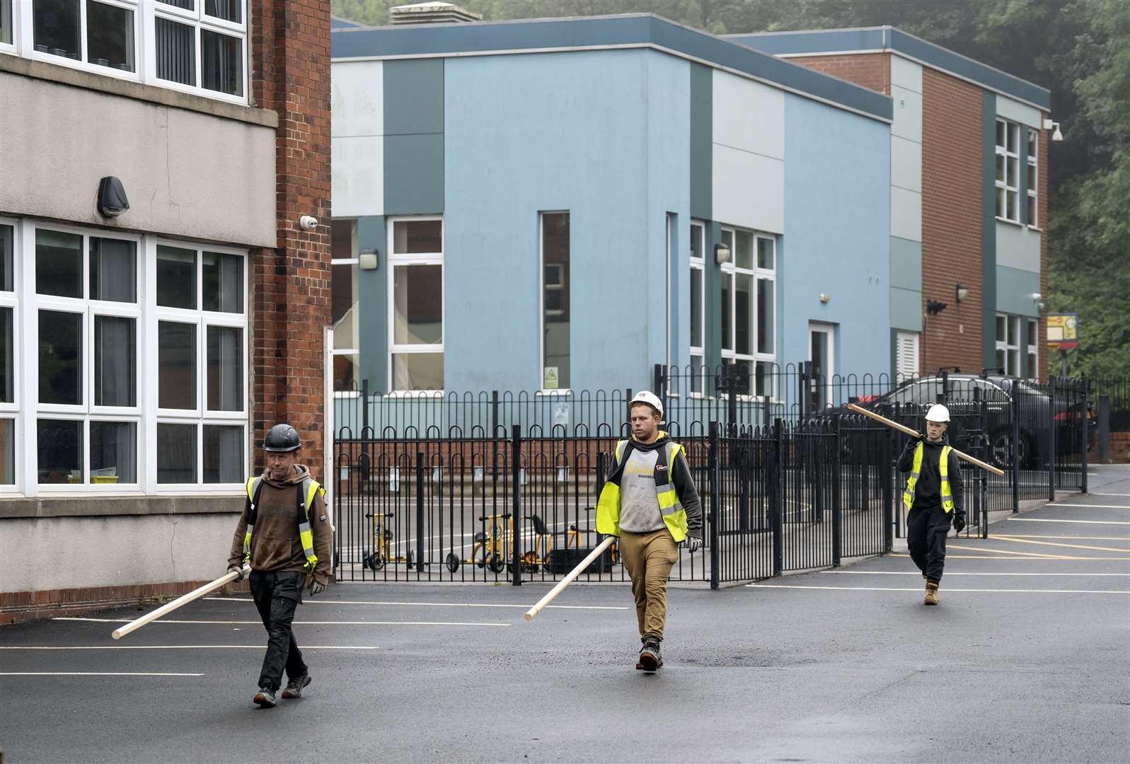 Workmen at Abbey Lane Primary School in Sheffield (Danny Lawson/PA)