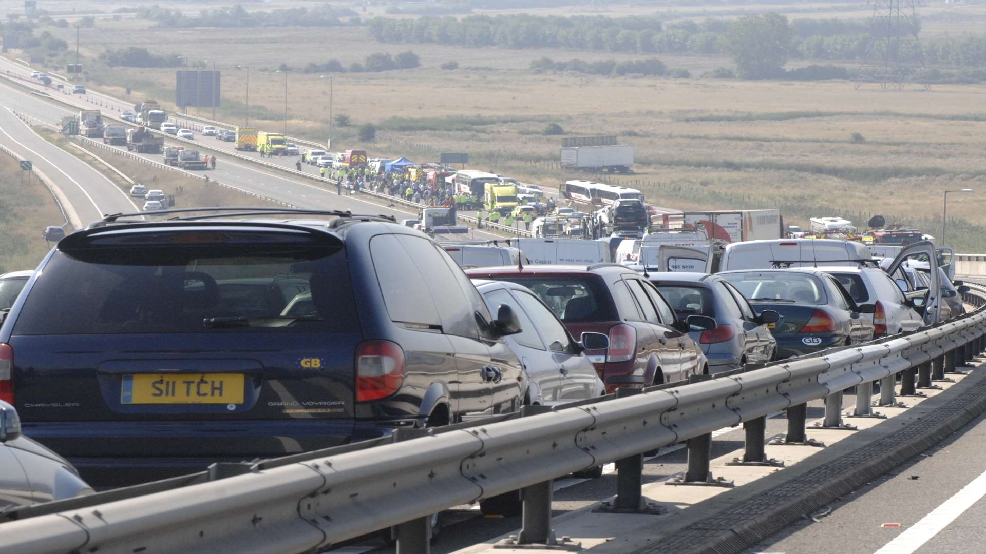 Trail of wrecked cars on the Sheppey Crossing