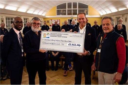 Council leader Trevor Bartlett, and deputy leader, Oliver Richardson with community officer Marvin Fishley, present a cheque to David Rance, chairman of Snowdown Colliery Welfare Male Choir. Picture: Dover District Council