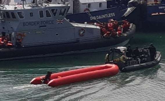 An empty dinghy is towed into Dover Marina. Picture: Sam Lennon