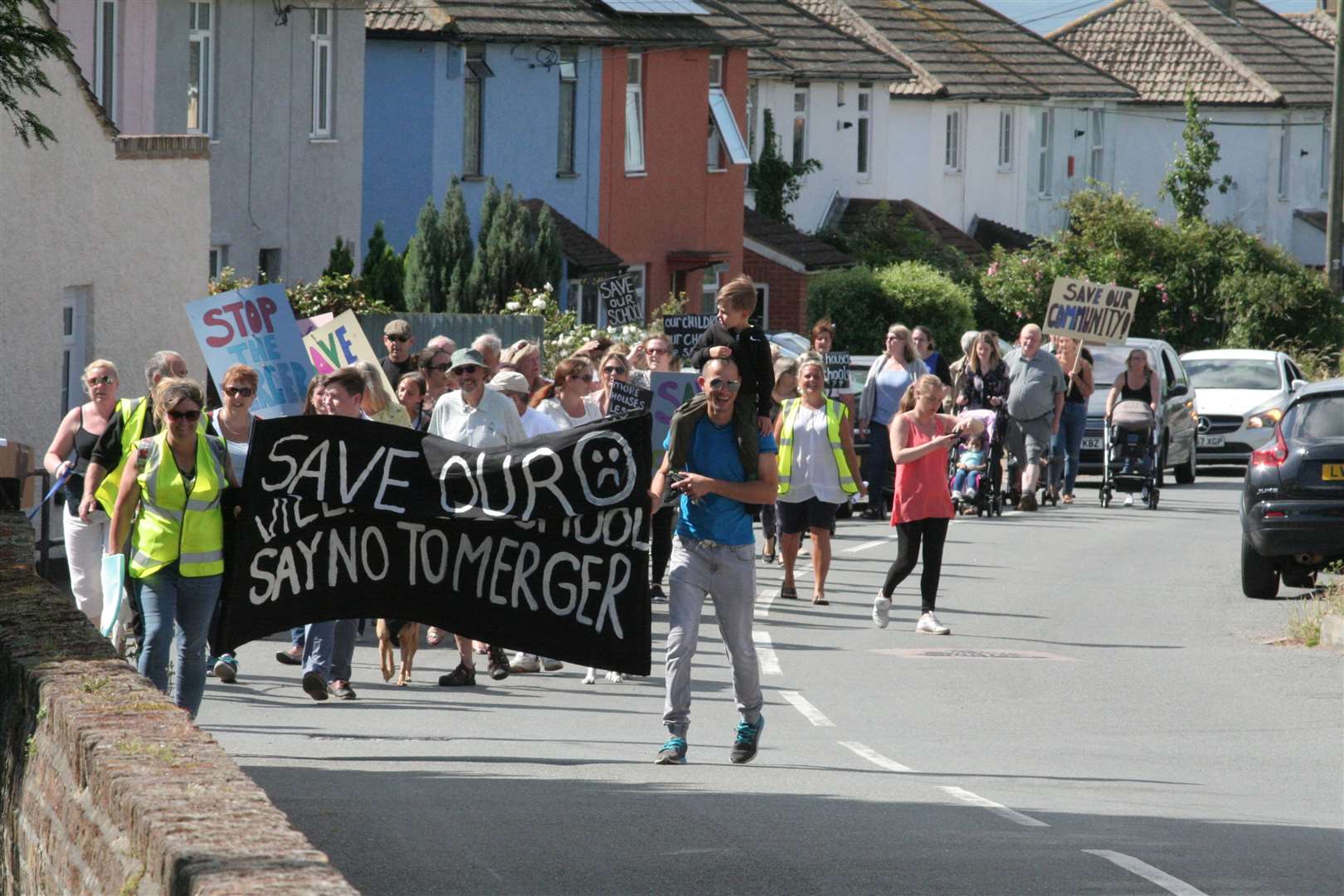 Protestors marched from Stoke Primary Academy to Allhallows Primary Academy to rally against merger plans in 2019