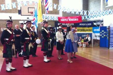 Queen watches dancing by children at Howe Barracks