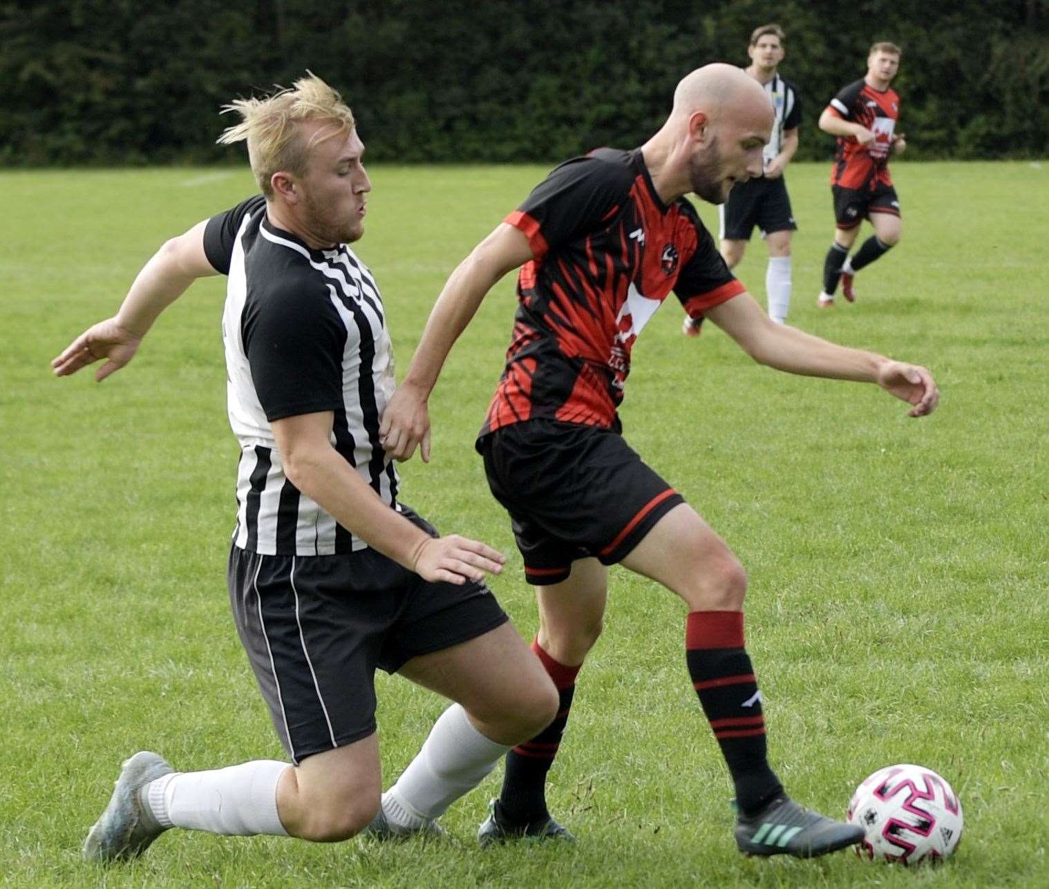 Medway Sport (red/black) in possession against Intergills. Picture: Barry Goodwin FM42034585
