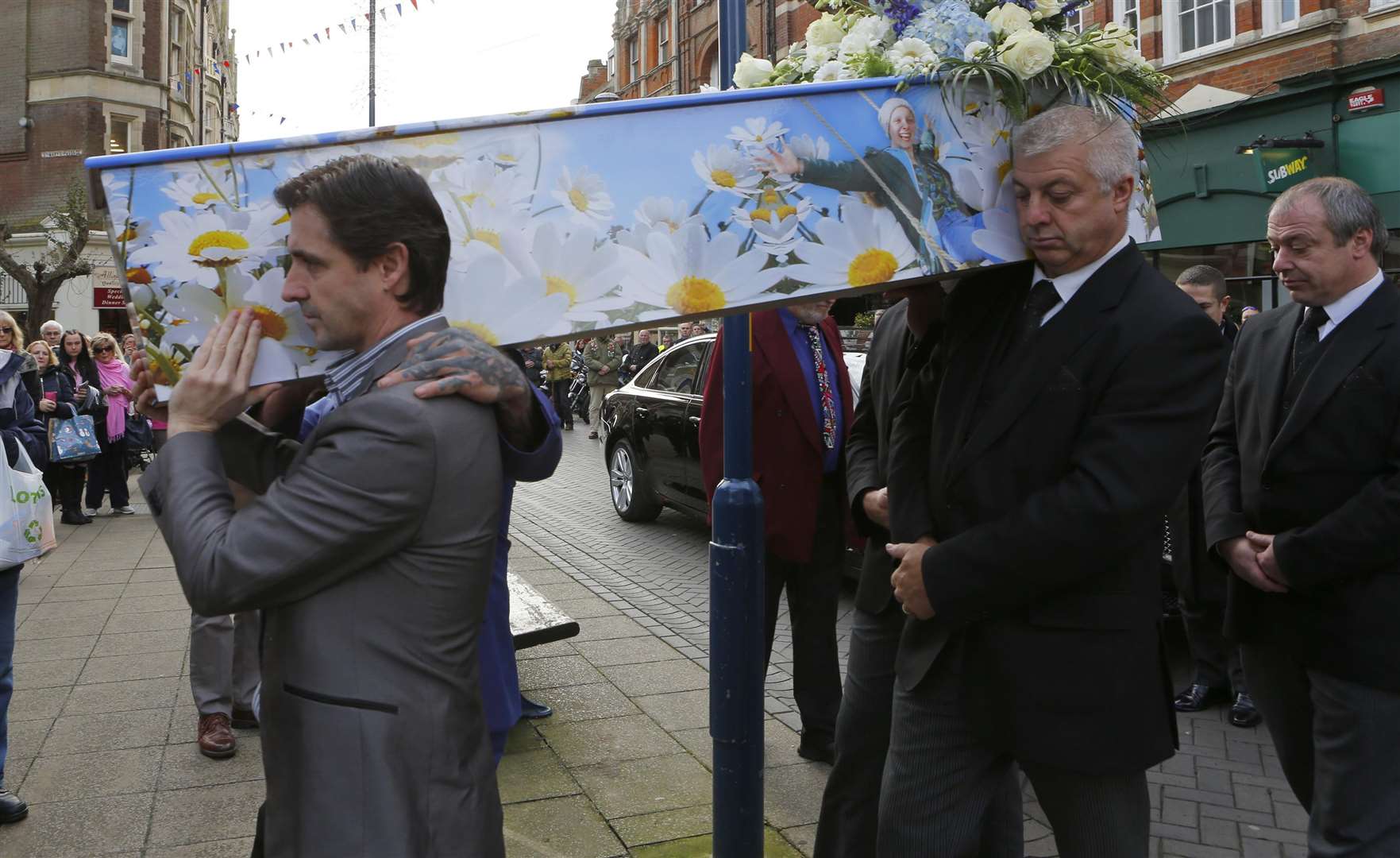 Kelly's coffin is carried into St Mary's Church in Dover
