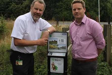 Swale council dog warden Tim Oxley and Cllr James Hunt (Con) with one of the dispensers