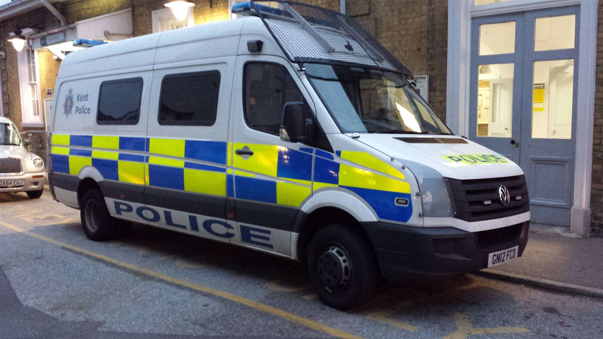 Police van parked at station.