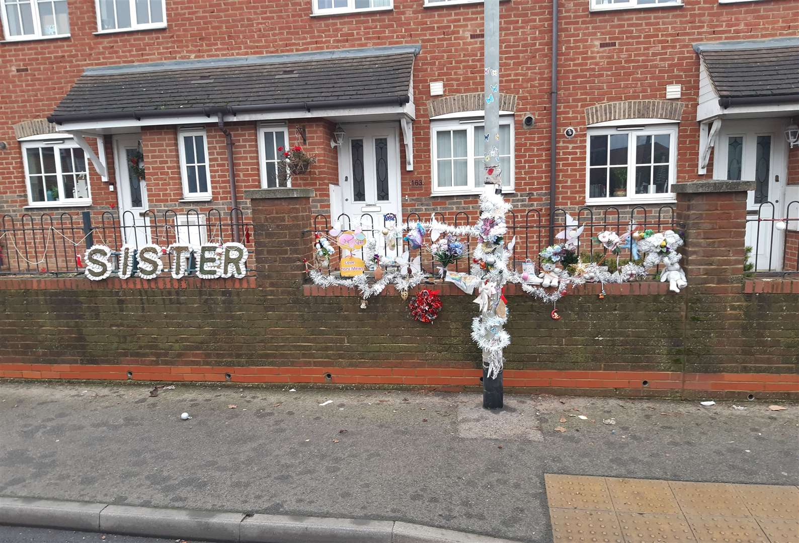 Tributes close to the scene where the 10-year-old was killed on Watling Street