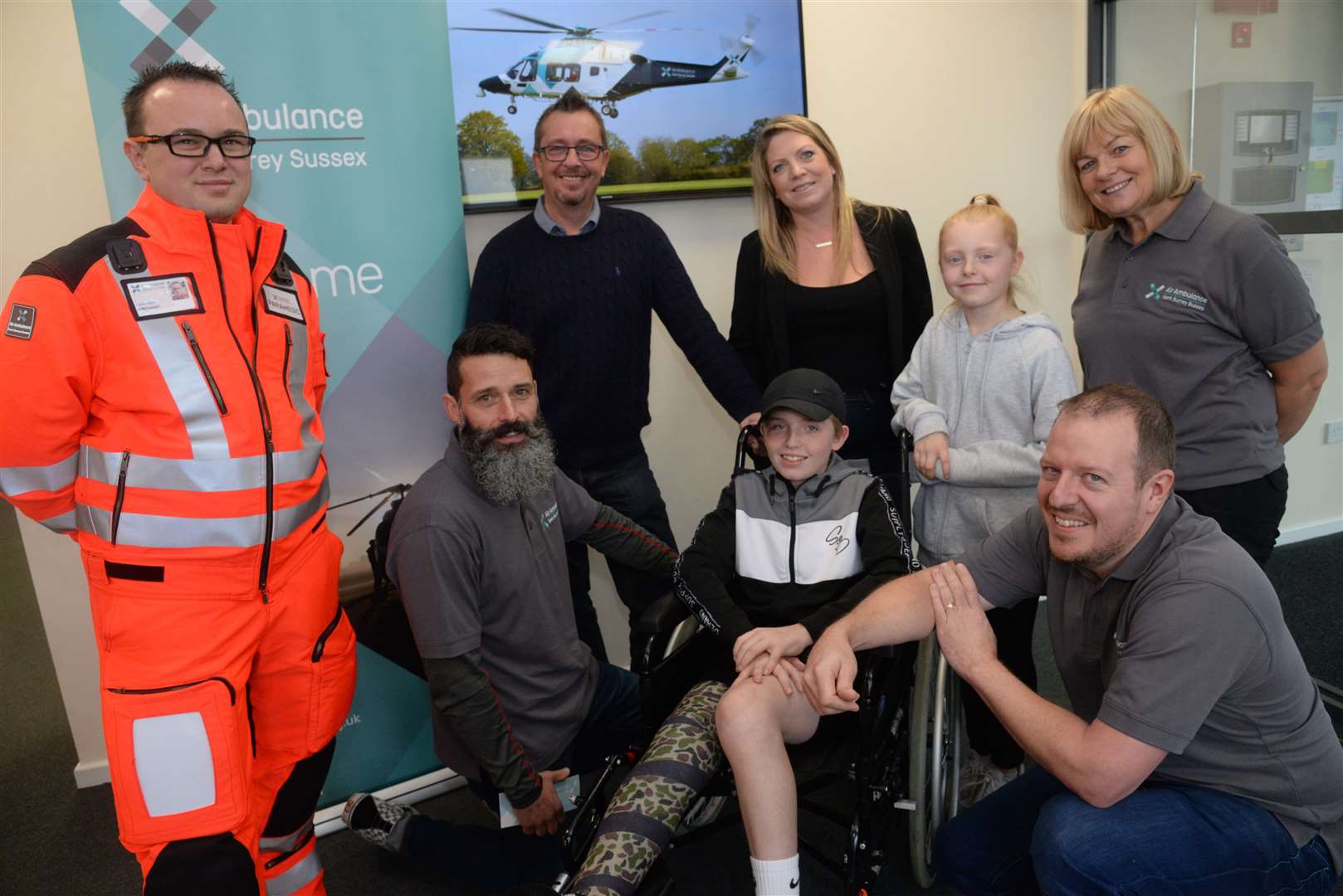 Paramedics Lewis Allam and Al Crawford with dispatcher Carol Lewis and critical care paramedic Dave Hawkins with Billy McLaren and his family, dad Michael, mum Karina and sister Elsie when he met Kent & Surrey Air Ambulance staff at Rochester Airport on Friday. Picture: Chris Davey (20623415)