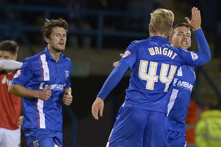Cody McDonald is congratulated by Josh Wright after rounding off an impressive Gills display with goal No.5 against Fleetwood