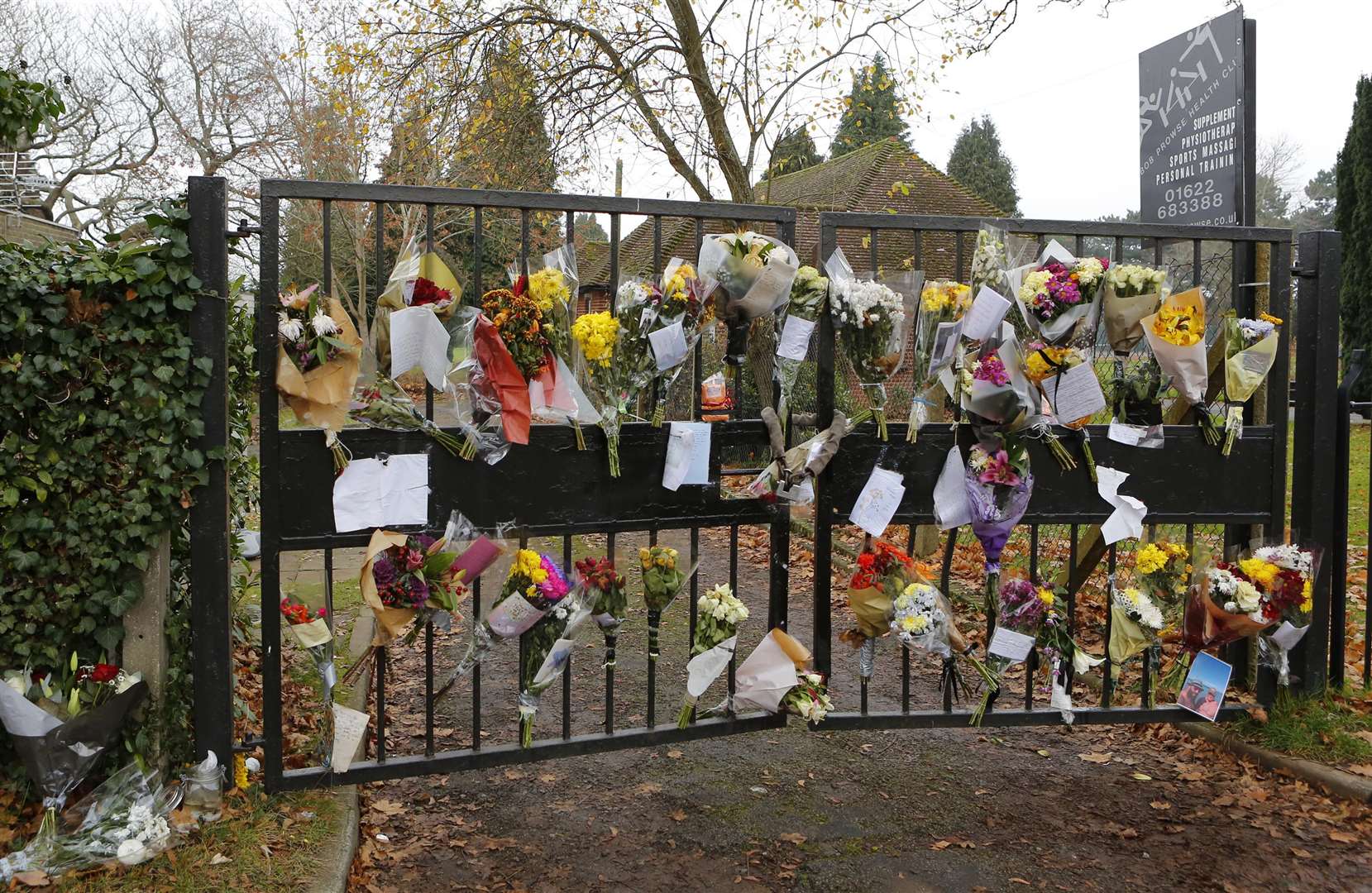 Floral tributes on the railings outside the club