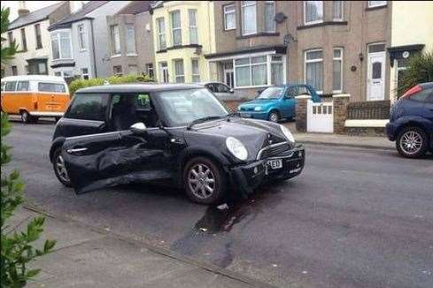 The car crashed into this Mini, injuring the female driver. Picture: Ben Cooper.