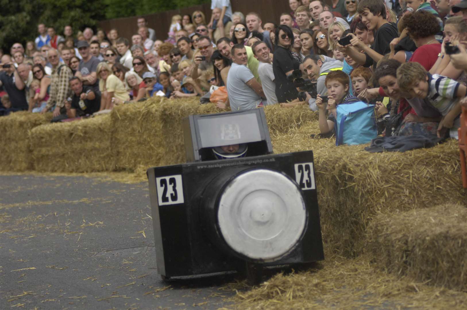 Sarah's Nikon by Emma Mcquillan brushes the hay bales in the chicane section. Picture : Gary Browne