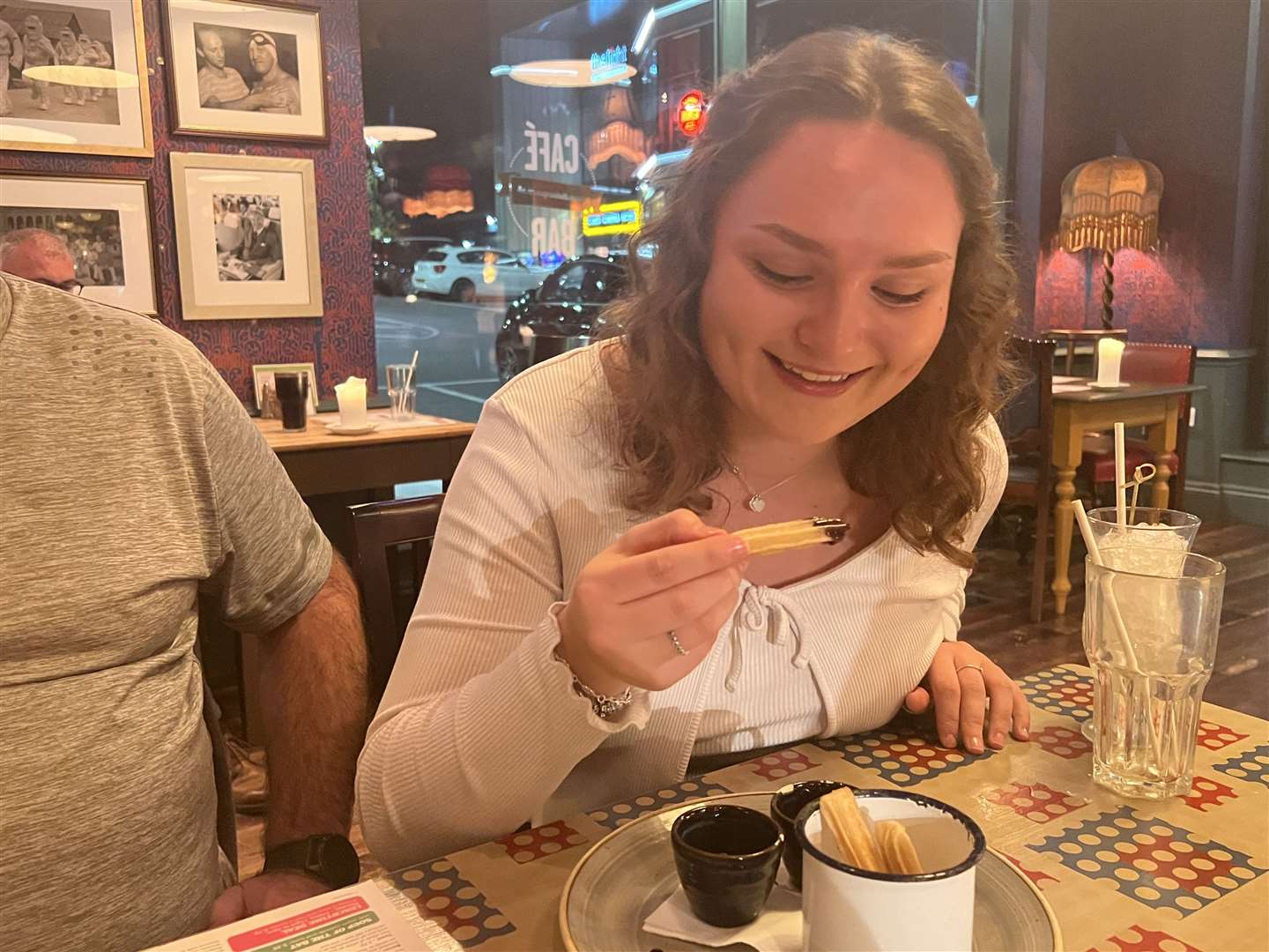 Reporter Megan eating a churro at Sentado Lounge, Sittingbourne