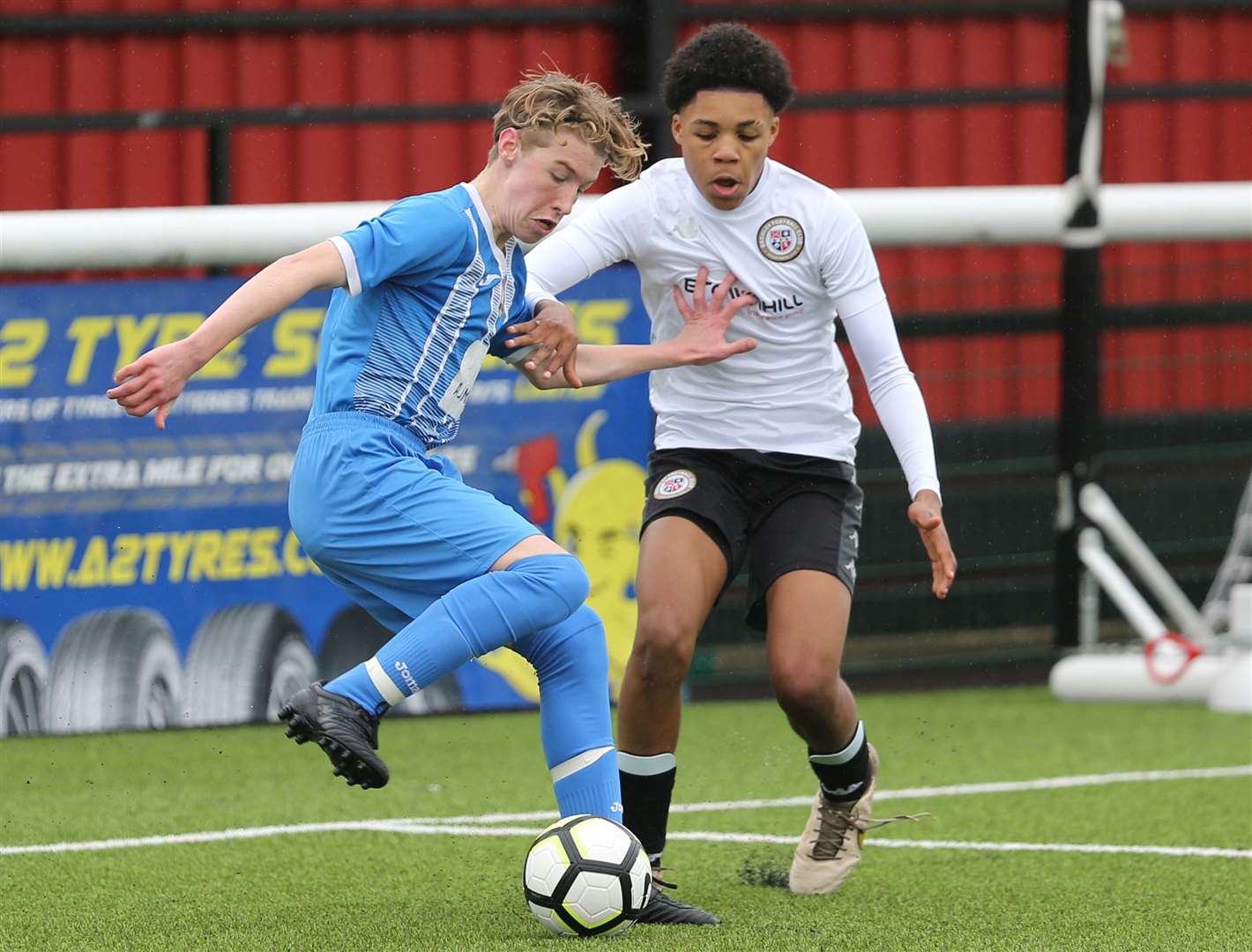 Bromley (white) up against Metrogas in the Kent Merit Under-14 Boys Cup Final. Picture: PSP Images