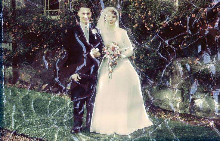A cracked and damaged wedding photo