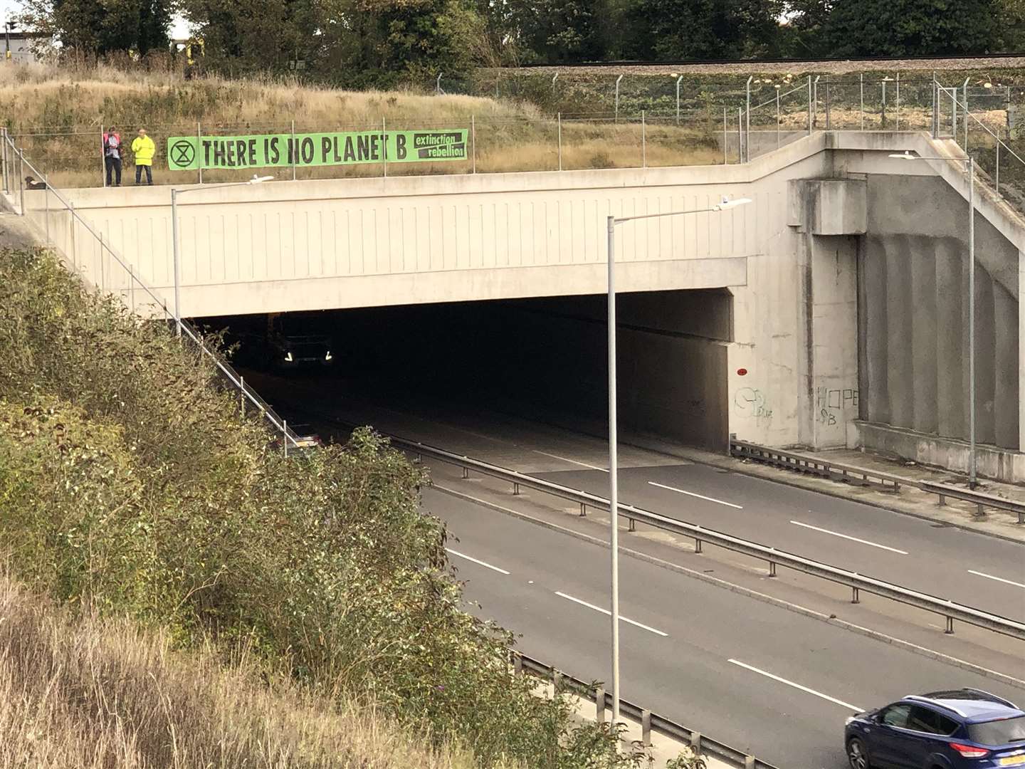 XR campaigners decorated a bridge with banners in opposition to the reopening of Manston Airport