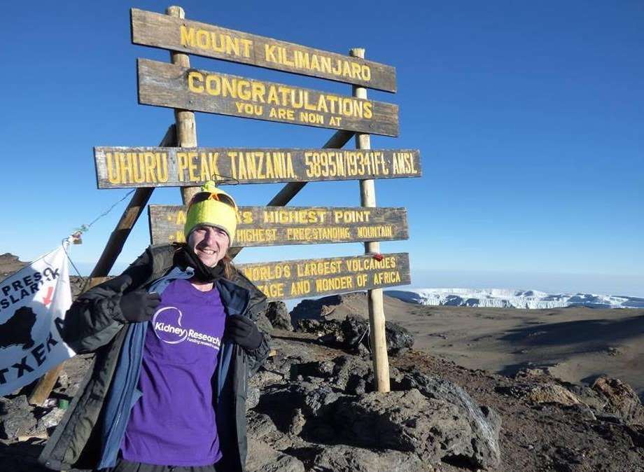 Ryan Brett at the top of Mount Kilimanjaro in Tanzania