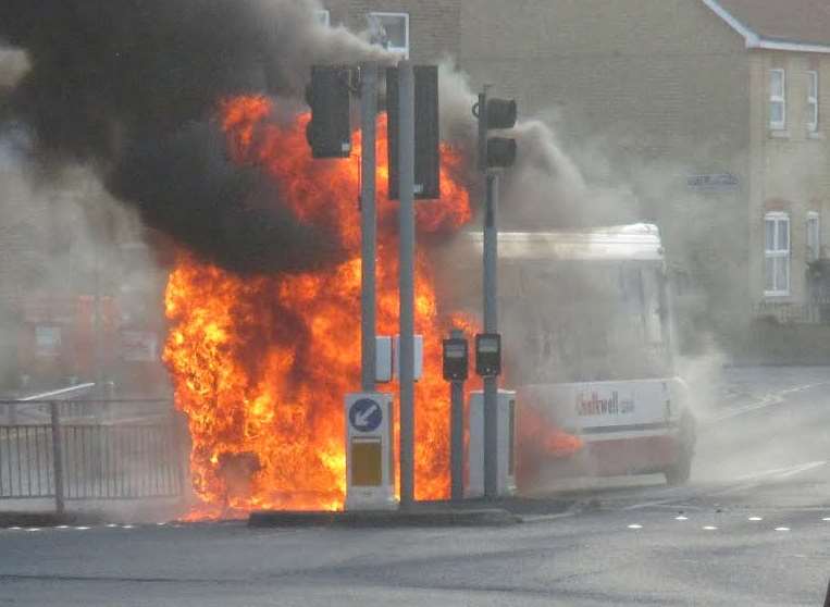 The bus on fire outside Sheerness train station. Picture by Paul Wanstall