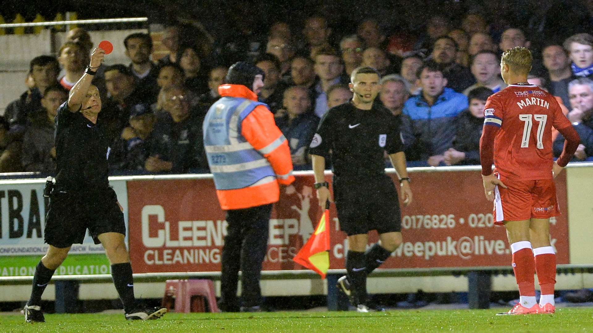 Lee Martin's night is over after his tackle on Lyle Taylor Picture: Ady Kerry