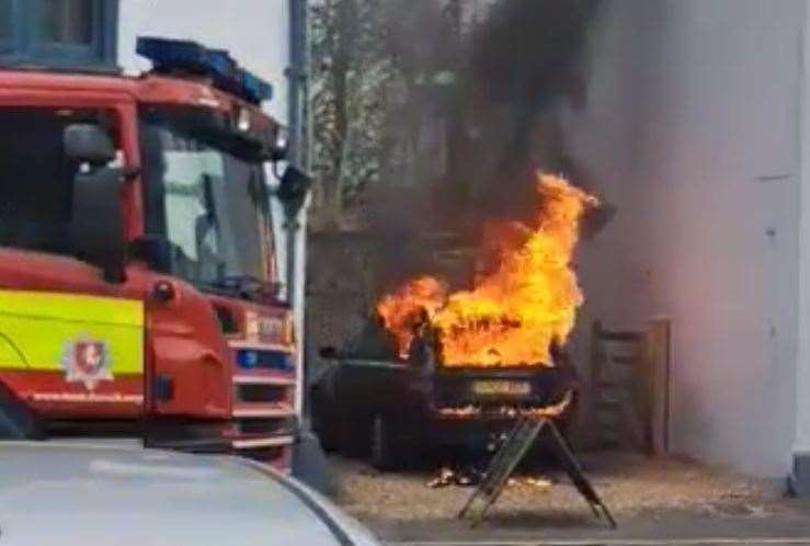 A car burst into flames next to The Farm House pub in West Malling High Street. Picture: Andy Lech