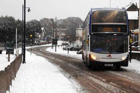 A bus struggles through Tower Parade, Whitstable on Thursday after heavy overnight snow.